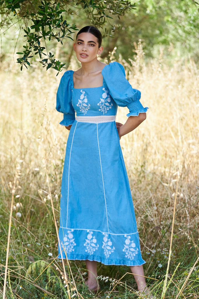Woman wearing Blue Midi Dress in field