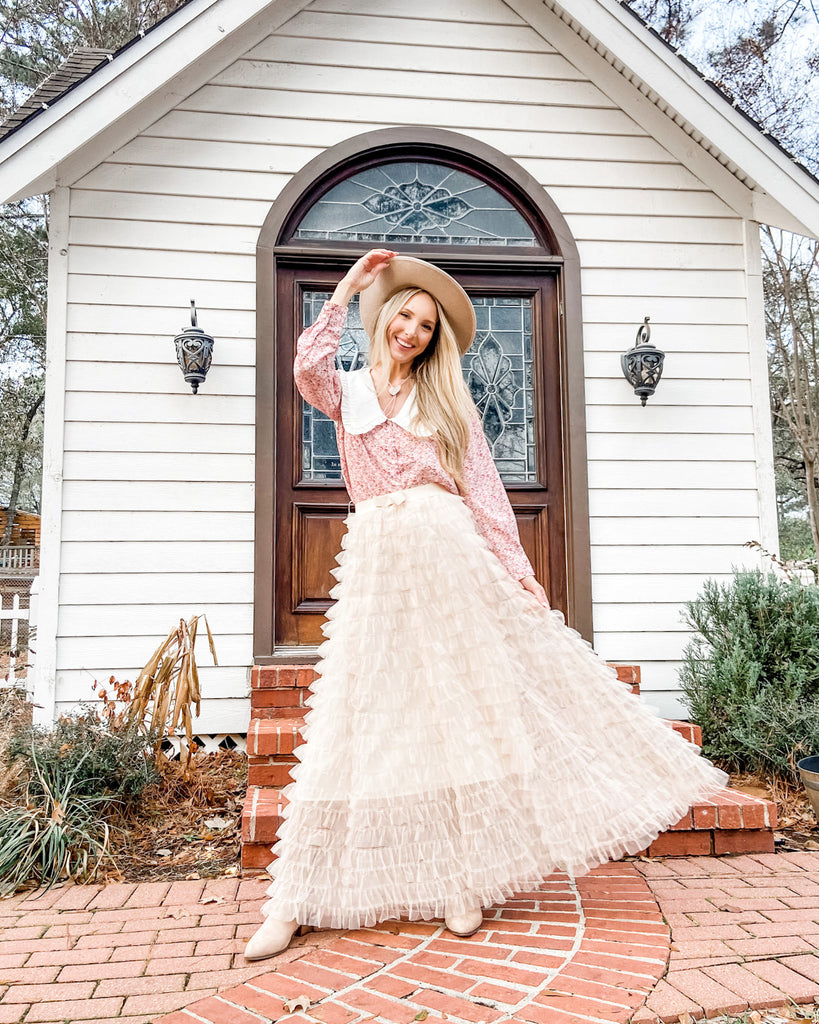 Woman in tiered flow tulle skirt and floral top