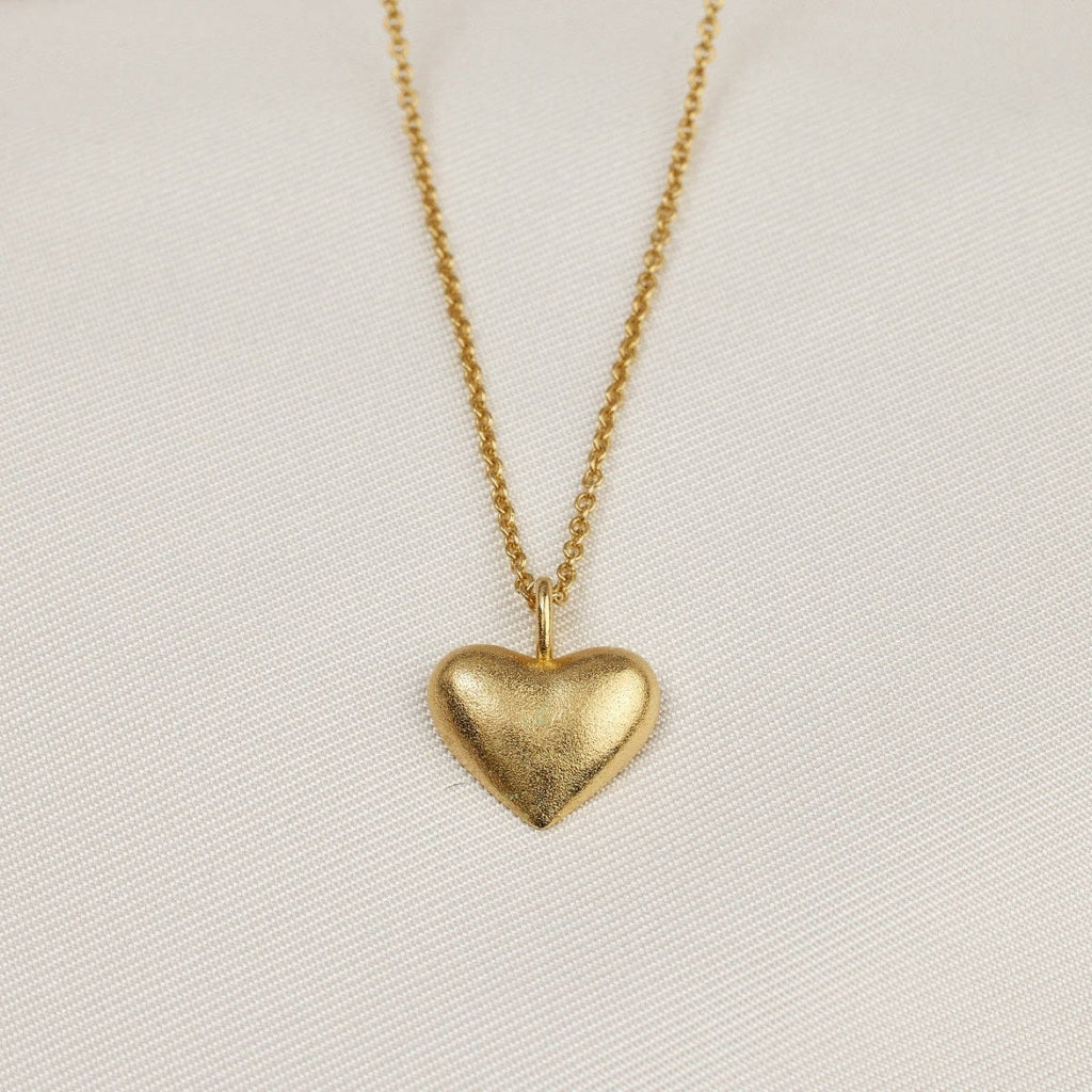 heart necklace on a gold chain 