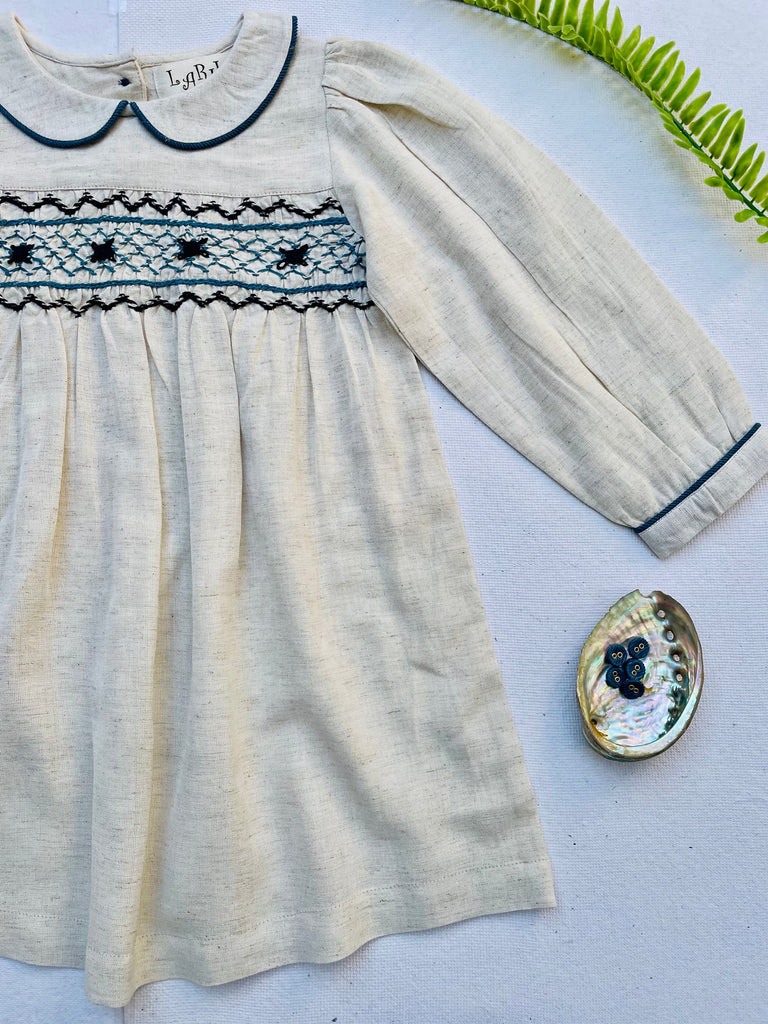 blue and cream embroidered dress